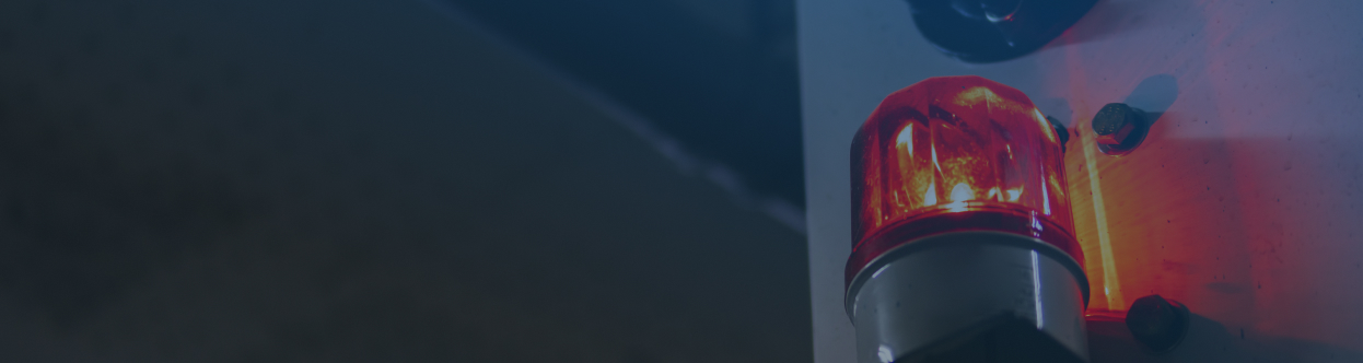 Close-up of a siren on ambulance, overlaid with a blue gradient