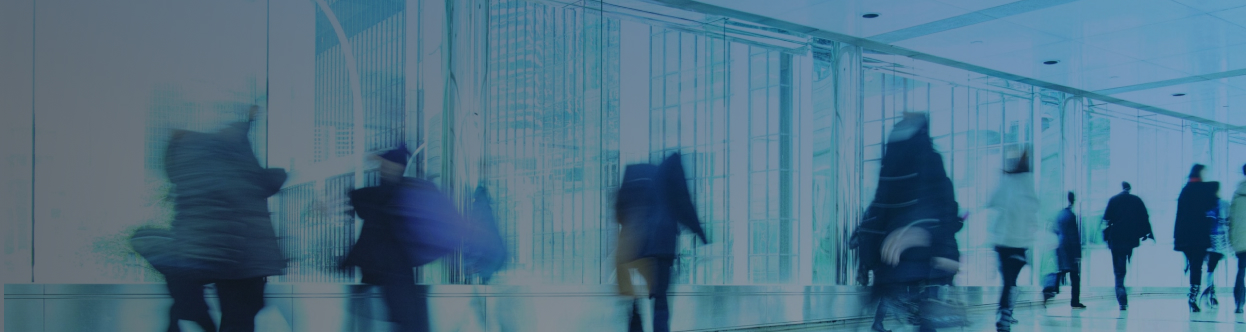 People walking hurriedly along a passage
